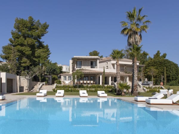 Koralli and its gardens rising above the splendid 18m-long infinity pool.